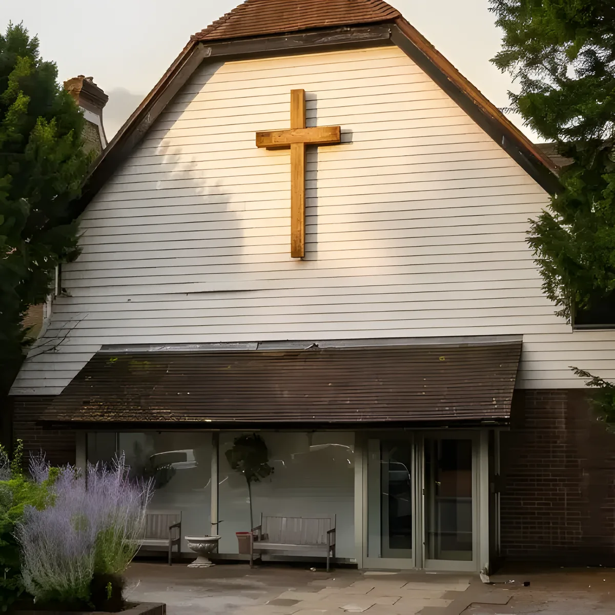 The front door of Hillside Church on Worple Road, beneath the timber cross